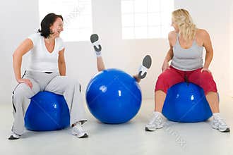 Women on fitness balls