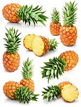 Fresh pineapple fruits with cut and green leaves