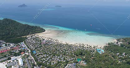 Aerial drone video of iconic tropical beach and resorts of Phi Phi island
