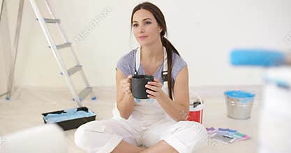 Young woman taking a coffee break