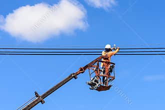 Electrician installing new power lines.