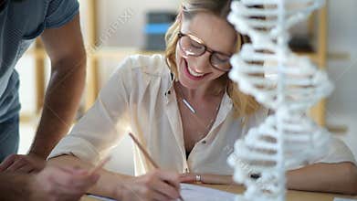 Close up of female student studying genetics with groupmate