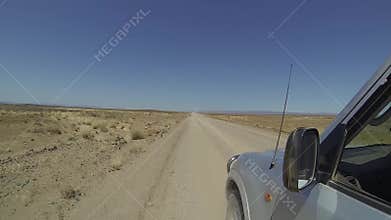 4x4 car driving on a dirt road