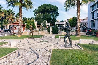Sculptures of rock stars on a small avenue in the city Durres. A
