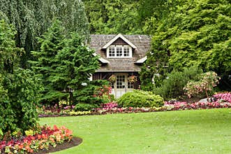 Landscaped cottage in woods