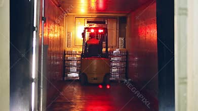 Forklift truck shipping packaged of milk bottles. Dairy industry. Milk delivery