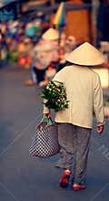 Vietnamese woman carrying bag