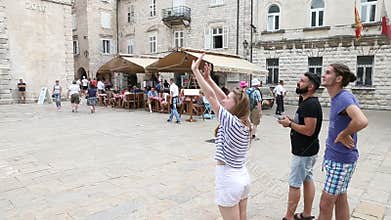 Kotor, Montenegro - 27 June, 2017. Young people launch a drone in the historic part of the old city. Drone flying high