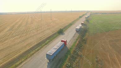 Overhead drone footage of transport network trucks shipping, supply chain