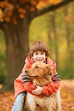 Boy Hugging the Dog