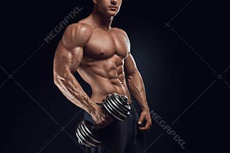 Strong and power bodybuilder doing exercises with dumbbell
