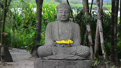 Statue of stone Buddha in the garden