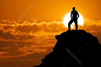 Man on top of mountain.