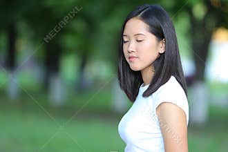 Young girl in the park are walking gait