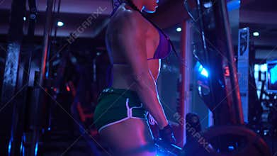 Brunette strong fitness woman at the gym