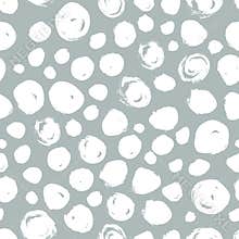 Polka dot seamless pattern. Hand drawn artistic ink circles. White blobs on grey background.