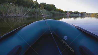 Fishing on a lake from rubber boat. first-person view