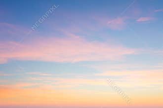 Background of sunrise sky with gentle colors of soft clouds