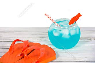 Cocktail in fish bowl with flip-flops