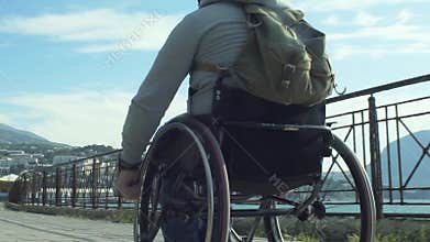 Paralyzed Man Using His Wheelchair