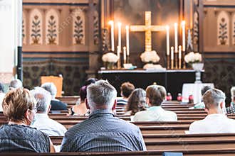 Holy mass in Christian church during the coronavirus pandemic Covid-19. Safe personal distance with protective masks