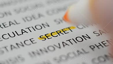 Macro shot highlighting the word `SECRET` with a yellow marker