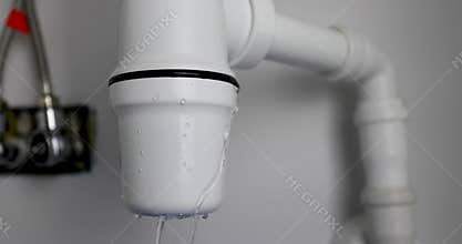 Leaking sink trap. broken siphon. wastewater leakage