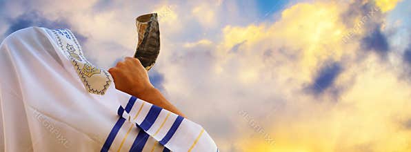 Jewish man blowing the Shofar horn of Rosh Hashanah New Year. Religious symbol