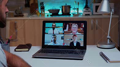 Business man having corporate meeting using laptop