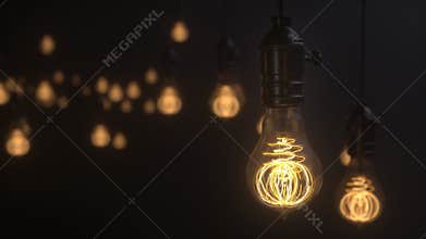 Edison lamps. Vintage light bulb pulsing light in the darkness. Burning retro light bulbs on black background. Depth of field.