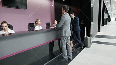 Business people at front desk