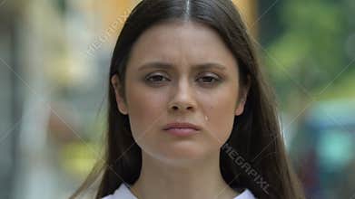 Crying young female suffering depression, feeling lonely, breakup crisis problem