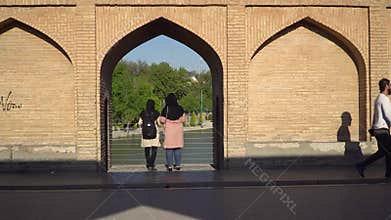 Iranian people on SioSePol or Bridge of 33 arches, Isfahan, Iran