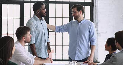 Best african male employee get rewarded at team meeting