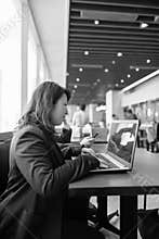 Mature beautiful Asian businesswoman working inside the restaurant