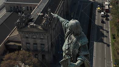 Aerial: close up circling Columbus Monument in Barcelona, Spain on Beautiful Sunny Day