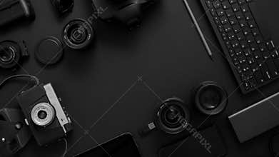Hotographer workspace concept. Various digital and analog gadgets placed on black background