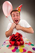 Happy young man celebrating birthday