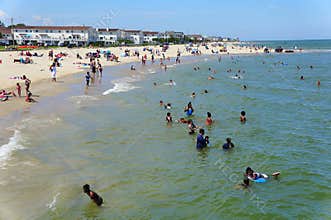 Crowds on the Buckroe Beach during a hot summer day