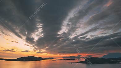 Alesund, Norway. Amazing Natural Bright Dramatic Sky In Warm Colours Above Alesund Valderoya And Islands In Sunset Time