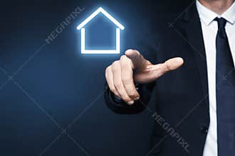 Property insurance concept. Man using virtual screen with house image, closeup