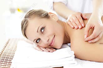 Smiling woman receiving an acupuncture treatment