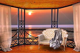 Luxury hotel balcony room with sunset ocean window view