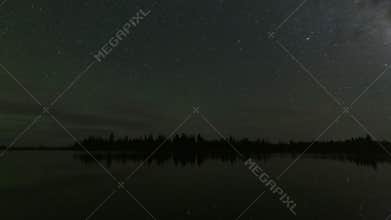 Timelapse video of starry sky reflected in lake
