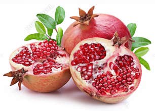 Juicy opened pomegranate with leaves.