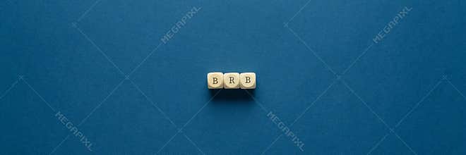 BRB abbreviation spelled on wooden dices