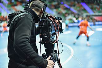 TV camera and cameraman during match