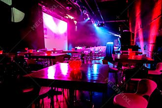 Empty Dark and Moody Night Club room with chairs and tables