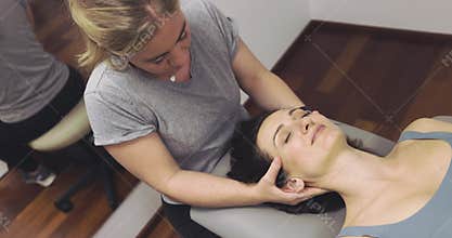 physical therapy session to better posture and stretch neck