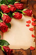 Frame with red roses and vintage paper